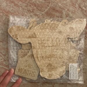 Wooden cow Milestone Sign